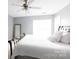 Bright bedroom featuring a ceiling fan and a large bed at 52538 Winchester St, Fort Mill, SC 29707