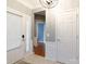 Bright foyer featuring tile flooring and white paneled walls, creating an inviting entry into the home at 52538 Winchester St, Fort Mill, SC 29707
