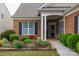 Charming front yard featuring lush landscaping surrounding the well-maintained home at 52538 Winchester St, Fort Mill, SC 29707