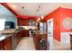 Well-equipped kitchen with stainless steel appliances, a center island, and bright lighting at 52538 Winchester St, Fort Mill, SC 29707