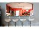 Bright kitchen featuring granite countertops, modern stools at the bar, and an open view to the dining area at 52538 Winchester St, Fort Mill, SC 29707