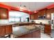 Bright kitchen featuring stainless steel appliances, large island, and view to living area at 52538 Winchester St, Fort Mill, SC 29707