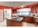 Gourmet kitchen featuring an island, granite countertops, and stainless steel appliances at 52538 Winchester St, Fort Mill, SC 29707
