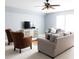 Comfortable living room features neutral tones, ceiling fan, and ample space for relaxing and entertaining guests at 52538 Winchester St, Fort Mill, SC 29707