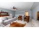 Comfortable living room features neutral tones, ceiling fan, and ample space for relaxing and entertaining guests at 52538 Winchester St, Fort Mill, SC 29707