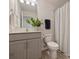 Neat bathroom with single vanity, neutral color palette, and shower curtain at 6037 Guildford Hill Ln, Charlotte, NC 28215