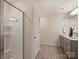Clean bathroom featuring a walk-in shower, double vanity, and modern finishes at 6037 Guildford Hill Ln, Charlotte, NC 28215