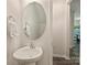 Powder room with single white pedestal sink and chrome faucet at 6037 Guildford Hill Ln, Charlotte, NC 28215