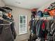 Spacious walk-in closet with window providing natural light at 6037 Guildford Hill Ln, Charlotte, NC 28215