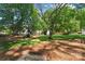 The backyard features a playset, a shed, and plenty of space for outdoor activities at 606 Deer Creek Dr, Matthews, NC 28105