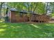 Well-maintained brick home with a deck and spacious backyard, great for outdoor living at 606 Deer Creek Dr, Matthews, NC 28105