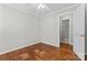 This bedroom includes hardwood flooring and an ensuite bathroom, offering privacy at 606 Deer Creek Dr, Matthews, NC 28105
