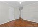 Charming bedroom featuring hardwood floors and neutral color palette with ceiling fan at 606 Deer Creek Dr, Matthews, NC 28105