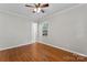Inviting bedroom offering hardwood floors, ample natural light, and a comfortable atmosphere at 606 Deer Creek Dr, Matthews, NC 28105