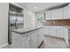 Modern kitchen boasts stainless steel appliances, granite countertops, and a stylish island at 606 Deer Creek Dr, Matthews, NC 28105