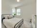 Bright bedroom with large windows and a comfortable bed, complemented by a stylish dresser at 6176 Russo Ct, Lancaster, SC 29720