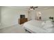 Light-filled bedroom featuring a ceiling fan and an ensuite bathroom at 6176 Russo Ct, Lancaster, SC 29720