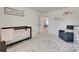 Bright Bedroom with a black crib, a patterned rug, and a plush glider at 6176 Russo Ct, Lancaster, SC 29720