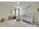 Charming Bedroom with a crib, glider, and playful giraffe art at 6176 Russo Ct, Lancaster, SC 29720