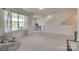 Airy bonus room with large windows and a cozy reading nook, perfect for relaxation and creativity at 6176 Russo Ct, Lancaster, SC 29720