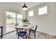 Breakfast nook featuring modern furnishings and natural light, with view of the backyard at 6176 Russo Ct, Lancaster, SC 29720
