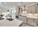 Modern kitchen featuring stainless appliances, a center island, and gray cabinets at 6176 Russo Ct, Lancaster, SC 29720