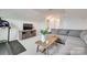 This living room offers a neutral color palette, grey sectional, and wood accents at 6176 Russo Ct, Lancaster, SC 29720