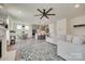 Open-concept living space with seamless flow between the kitchen, dining area, and a comfortable living room setup at 6176 Russo Ct, Lancaster, SC 29720