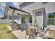 The covered patio features comfortable seating, a dining table, and shade for relaxation at 6176 Russo Ct, Lancaster, SC 29720