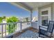 Relax on this covered porch with scenic views of neighboring homes and blue skies at 6176 Russo Ct, Lancaster, SC 29720