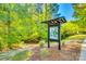 View of a map for the trail system within the community surrounded by woods and landscaping at 6176 Russo Ct, Lancaster, SC 29720