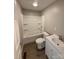Clean, white bathroom features a shower-tub combo, modern fixtures, and neutral flooring at 654 Old Nc 515 Hwy, Wadesboro, NC 28170