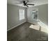 Cozy bedroom with two windows allowing natural light and modern ceiling fan at 654 Old Nc 515 Hwy, Wadesboro, NC 28170
