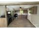 The kitchen boasts stainless appliances, gray cabinets, and open concept design at 654 Old Nc 515 Hwy, Wadesboro, NC 28170