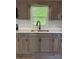 Close up of sink, faucet, and stone countertops in a modern kitchen at 654 Old Nc 515 Hwy, Wadesboro, NC 28170