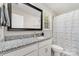 Well-lit bathroom features a granite countertop vanity with a tub and shower combo at 658 Morgan Rd, Albemarle, NC 28001