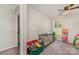 Spacious bedroom featuring a ceiling fan, large window, dresser, and adjacent bath at 658 Morgan Rd, Albemarle, NC 28001
