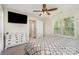 Bright bedroom showcases a large window, a ceiling fan, and white dresser at 658 Morgan Rd, Albemarle, NC 28001