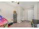 Spacious bedroom featuring a ceiling fan, large window, dresser, and play area at 658 Morgan Rd, Albemarle, NC 28001