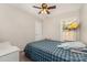 Bright bedroom features a ceiling fan and a large window and play area at 658 Morgan Rd, Albemarle, NC 28001