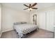 Comfortable bedroom features a ceiling fan, a double door closet, and ensuite bathroom at 658 Morgan Rd, Albemarle, NC 28001