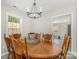 Dining area featuring a wooden table with six chairs and a modern chandelier at 658 Morgan Rd, Albemarle, NC 28001