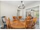 Dining area featuring a wooden table with six chairs and a modern chandelier at 658 Morgan Rd, Albemarle, NC 28001