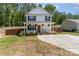Charming two-story home with a welcoming front porch, landscaped yard, and a long driveway at 658 Morgan Rd, Albemarle, NC 28001