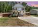 Charming two-story home with a welcoming front porch, landscaped yard, and a long driveway at 658 Morgan Rd, Albemarle, NC 28001