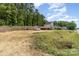Property featuring a large yard, shed, and home with great curb appeal at 658 Morgan Rd, Albemarle, NC 28001