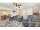 Inviting living room and dining area with a grey couch, recliner, and dining table at 658 Morgan Rd, Albemarle, NC 28001