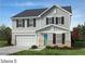 Charming two-story home with gray siding, a two-car garage, and a well-manicured front lawn at 6888 Wilson Creek Dr, Indian Land, SC 29707