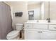 Bathroom with toilet, vanity with mirror, shower with grey curtain at 6912 Park Place Dr, Charlotte, NC 28262