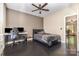 Bedroom with hardwood floors, ceiling fan, and view of living area through door at 6912 Park Place Dr, Charlotte, NC 28262
